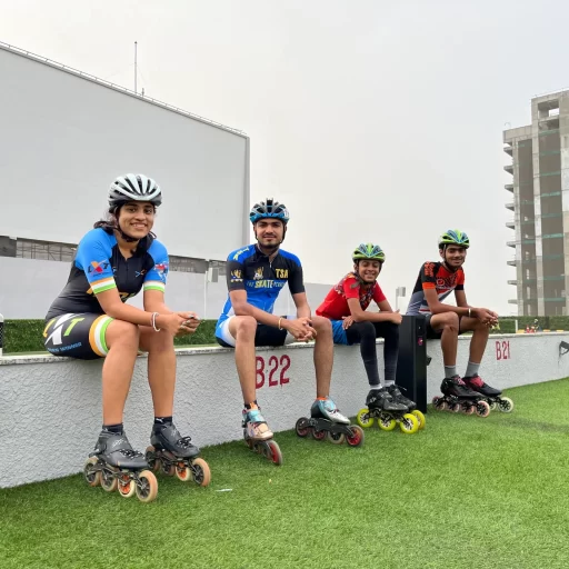 Students sitting at the rooftop speed skating competition organised by The Skate Academy